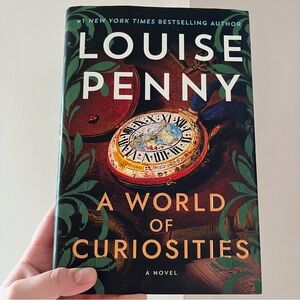 A World of Curiosities by Louise Penny Hardcover Book